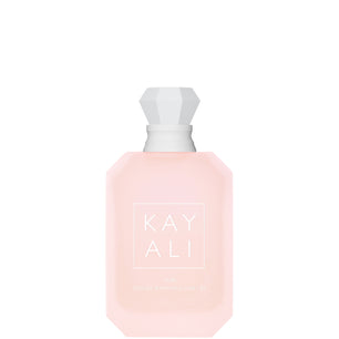 Pink perfume bottle with white cap on a white background