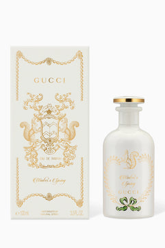 Gucci perfume bottle and packaging on a white background
