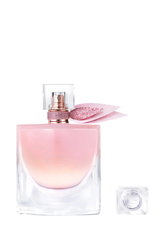 Pink and clear perfume bottle with cap on a white background