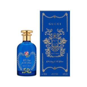Gucci perfume bottle and packaging on a white background