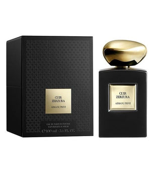 Black and gold Armani Prive Cuir Zerzura perfume bottle and packaging on a white background