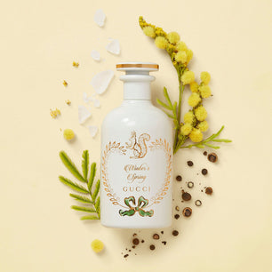 Gucci beauty product with floral elements on a beige background