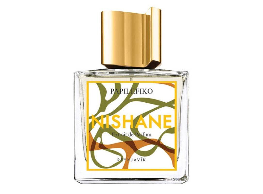 Perfume bottle with gold cap and colorful label on a white background