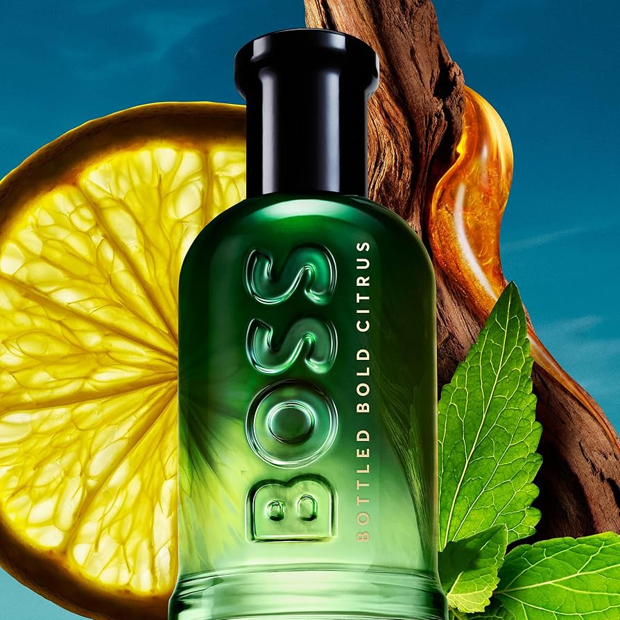 BOSS Bottled Bold Citrus perfume bottle with lemon and leaves on a blue background