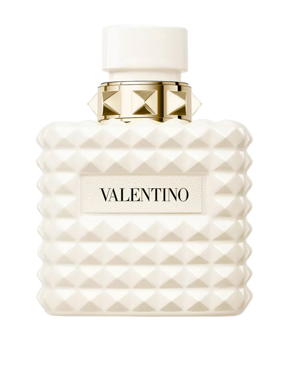 Valentino perfume bottle with white diamond pattern and gold cap on a white background