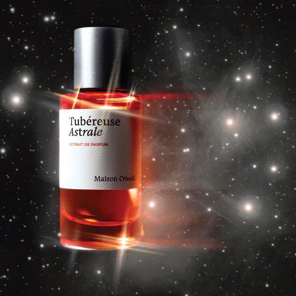 Perfume bottle labeled 'Tubereuse Astrale' against a starry space background