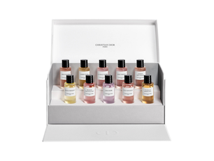 Set of Christian Dior perfume bottles in a display box on a white background