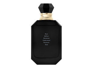 Black perfume bottle with gold cap on a white background