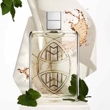 Glass perfume bottle with decorative elements on a white background