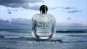 Perfume bottle with 'Acqua di Gioia' on a background of ocean waves and cloudy sky