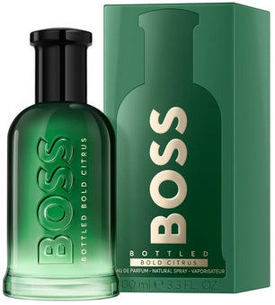 Green BOSS bottled perfume with packaging on a white background